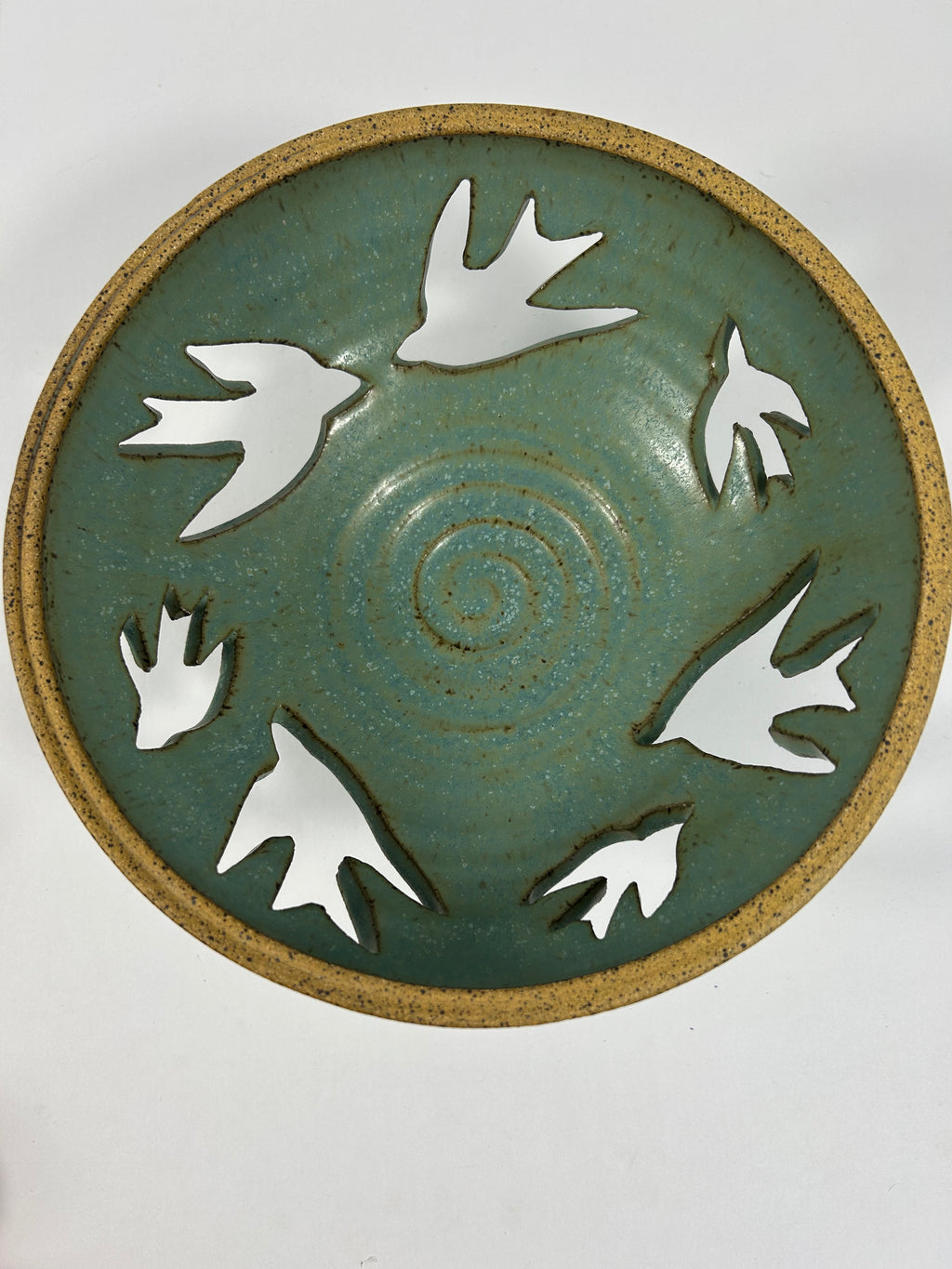 Stoneware green-blue bowl with bird piercings 
