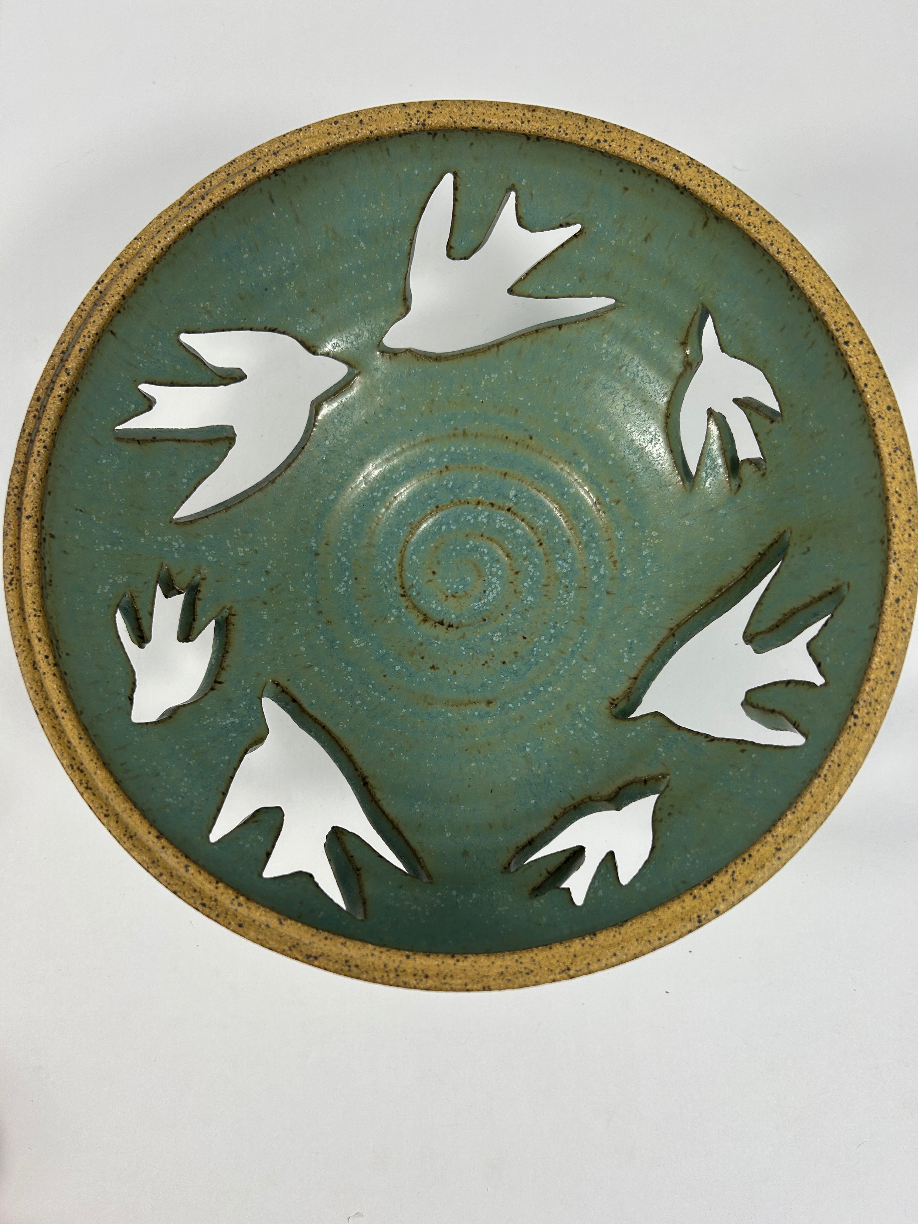 Stoneware green-blue bowl with bird piercings 