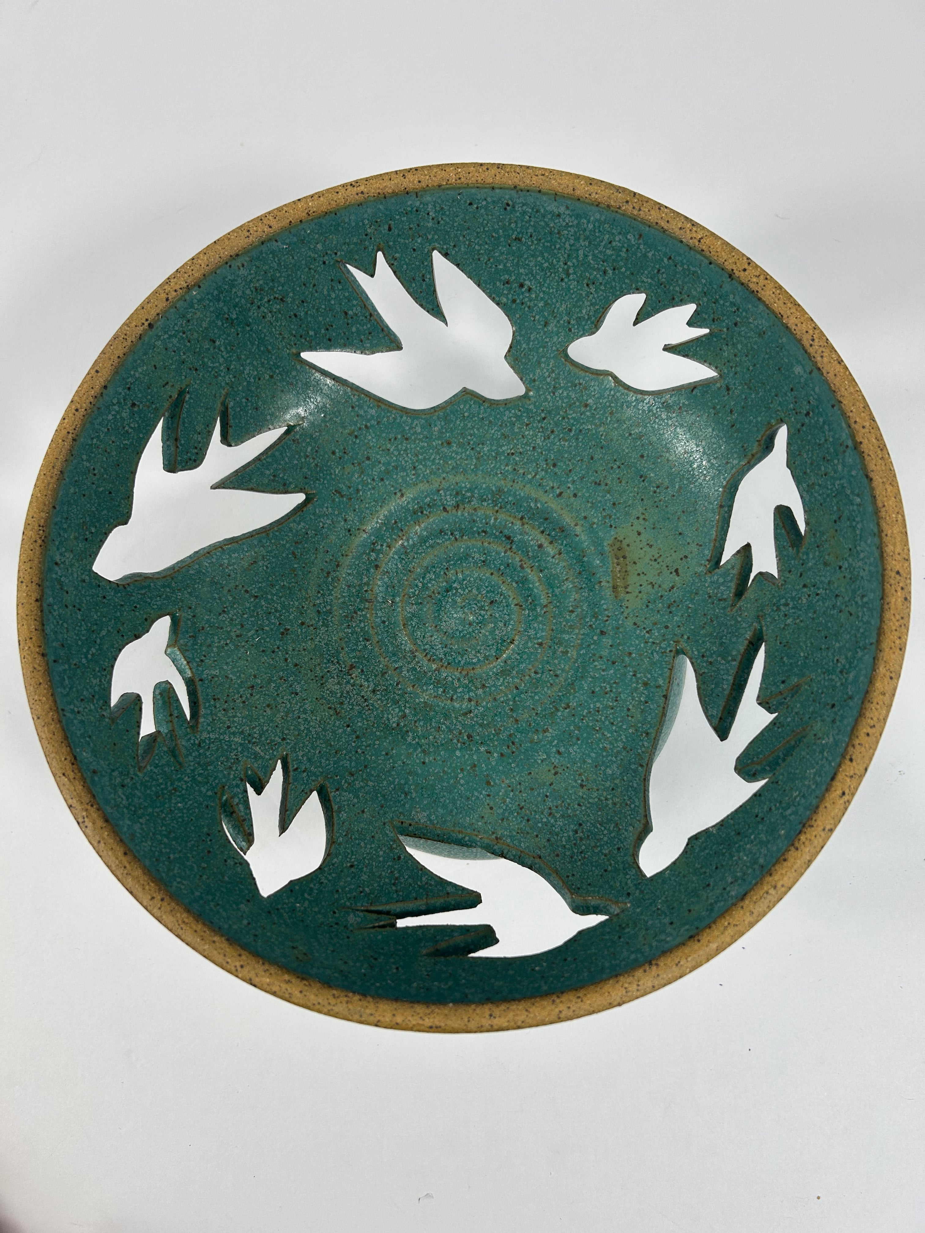 Stoneware teal  bowl with swallow cut-outs