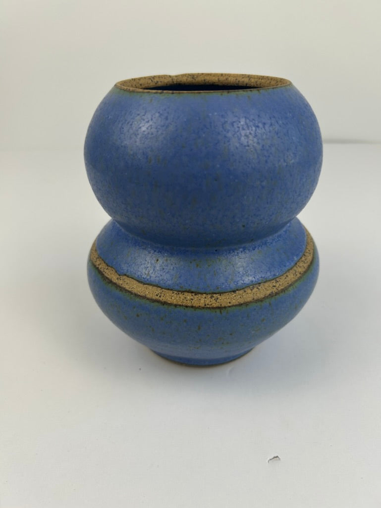 A ceramic vase with a two-bulb double-berry shape, featuring a speckled blue glaze and a contrasting textured tan-brown unglazed rim and band.