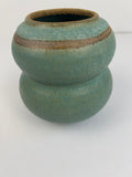 Stoneware 2-tier vase with blue-green speckled glaze and tan band. 