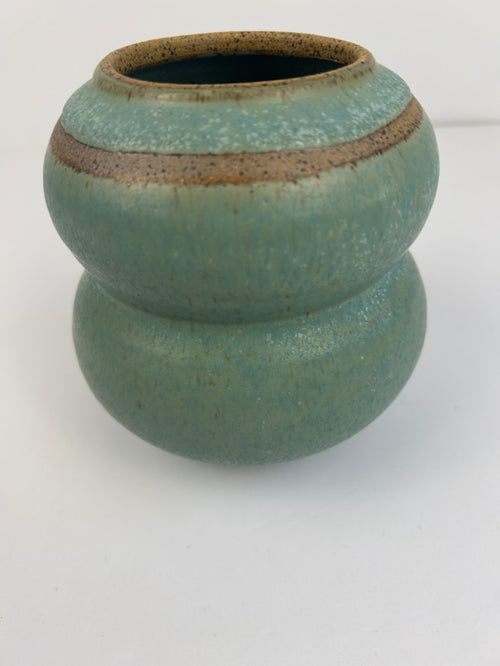 Stoneware 2-tier vase with blue-green speckled glaze and tan band. 